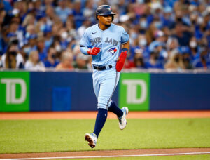 TORONTO, ON - AUGUST 23: Santiago Espinal #5 of the Toronto Blue Jays scores a run during a MLB game against the Chicago White Sox at Rogers Centre on August 23, 2021 in Toronto, Ontario, Canada. (Photo by Vaughn Ridley/Getty Images)