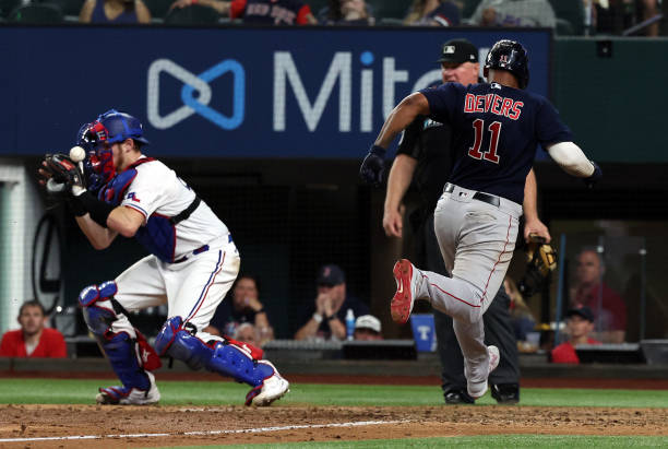 Xander Bogaerts, Rafael Devers, and J.D. Martinez of the Boston Red News  Photo - Getty Images