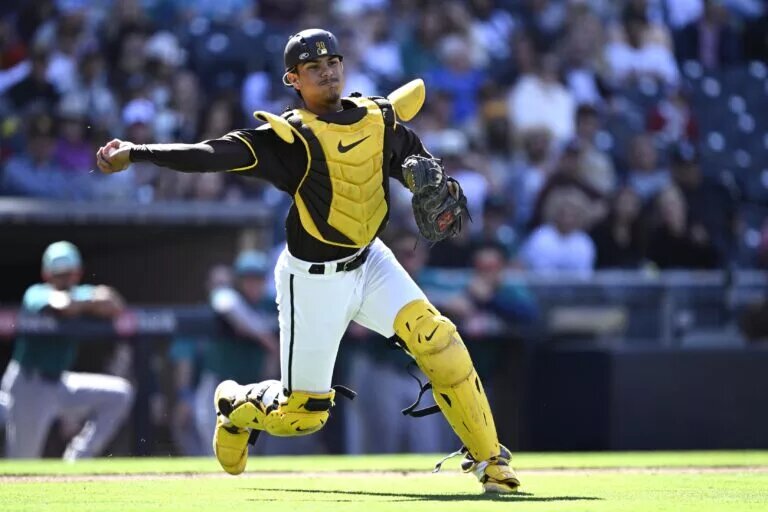 Padres catcher Ethan Salas (88) throws to first base in an exhibition game at Petco Park.
