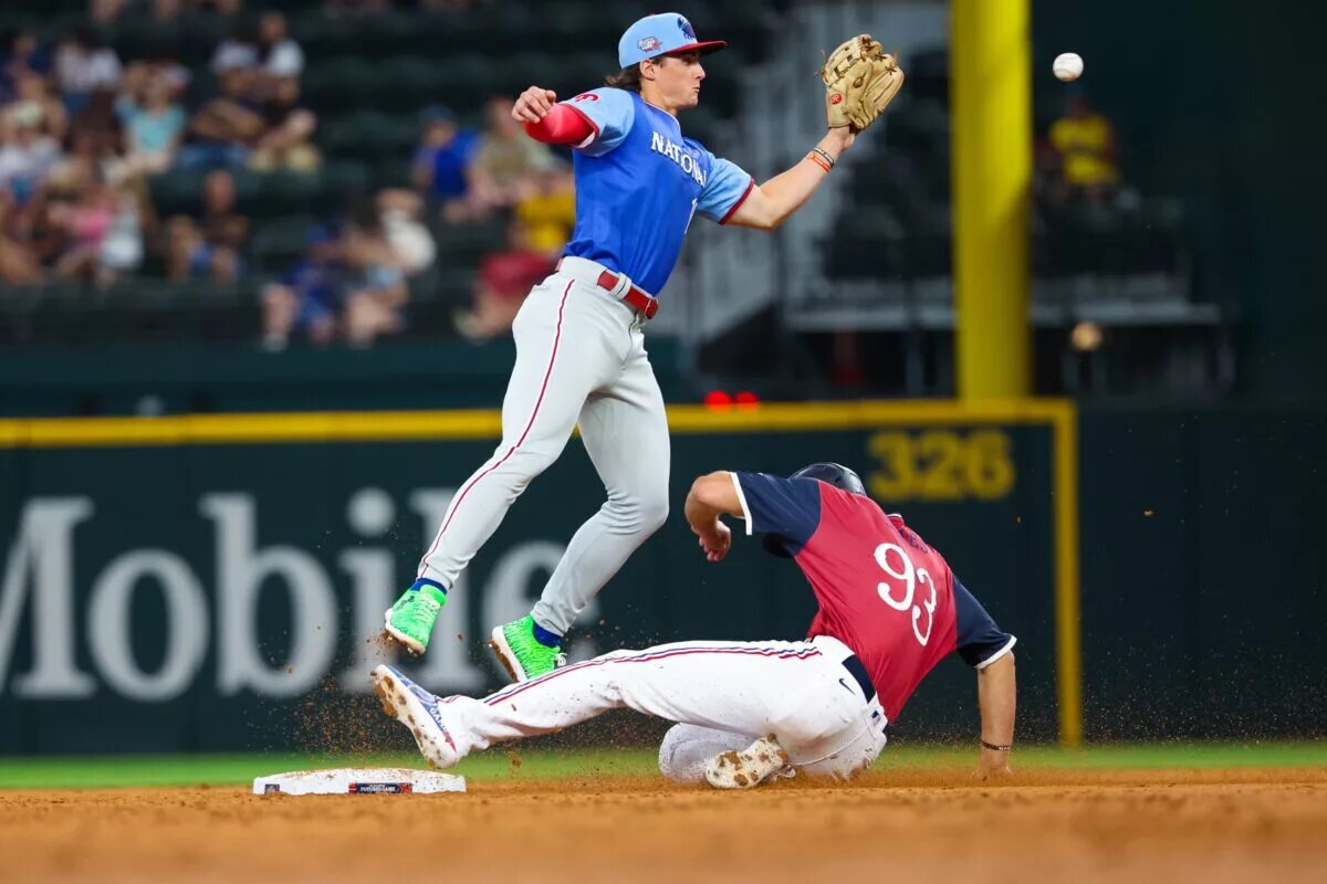 Phillies prospect Aidan Miller (in blue) could evetually become a regular third baseman rather than a shortstop.