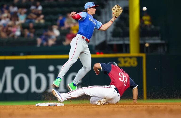 Phillies prospect Aidan Miller (in blue) could evetually become a regular third baseman rather than a shortstop.