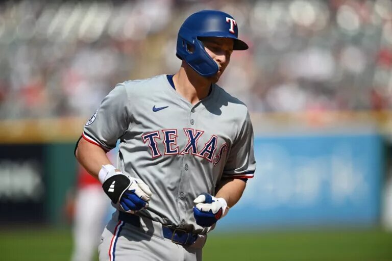 Texas Rangers shortstop Corey Seager (5) rounds the bases after hitting a home run during the eighth inning against the Cleveland Guardians at Progressive Field in August 2024.