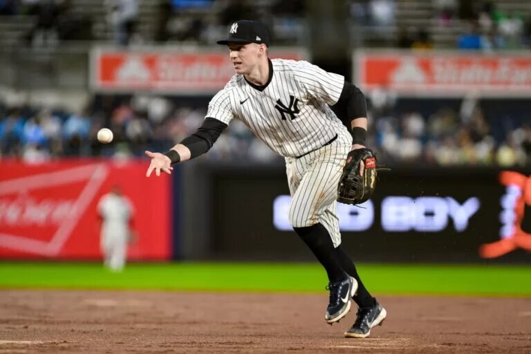 Yankees first baseman Ben Rice (93) makes an errant toss to first base after fielding a ground ball against the Pittsburgh Pirates during the sixth inning at Yankee Stadium.