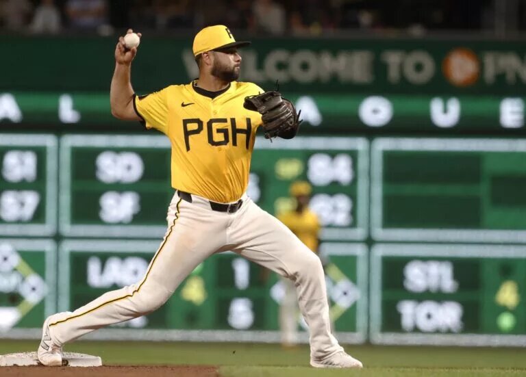 Shortstop Isiah Kiner-Falefa (7), since part of a deadline Pirates trade, throws to first base after a force out at second base at PNC Park during the 2024 season.