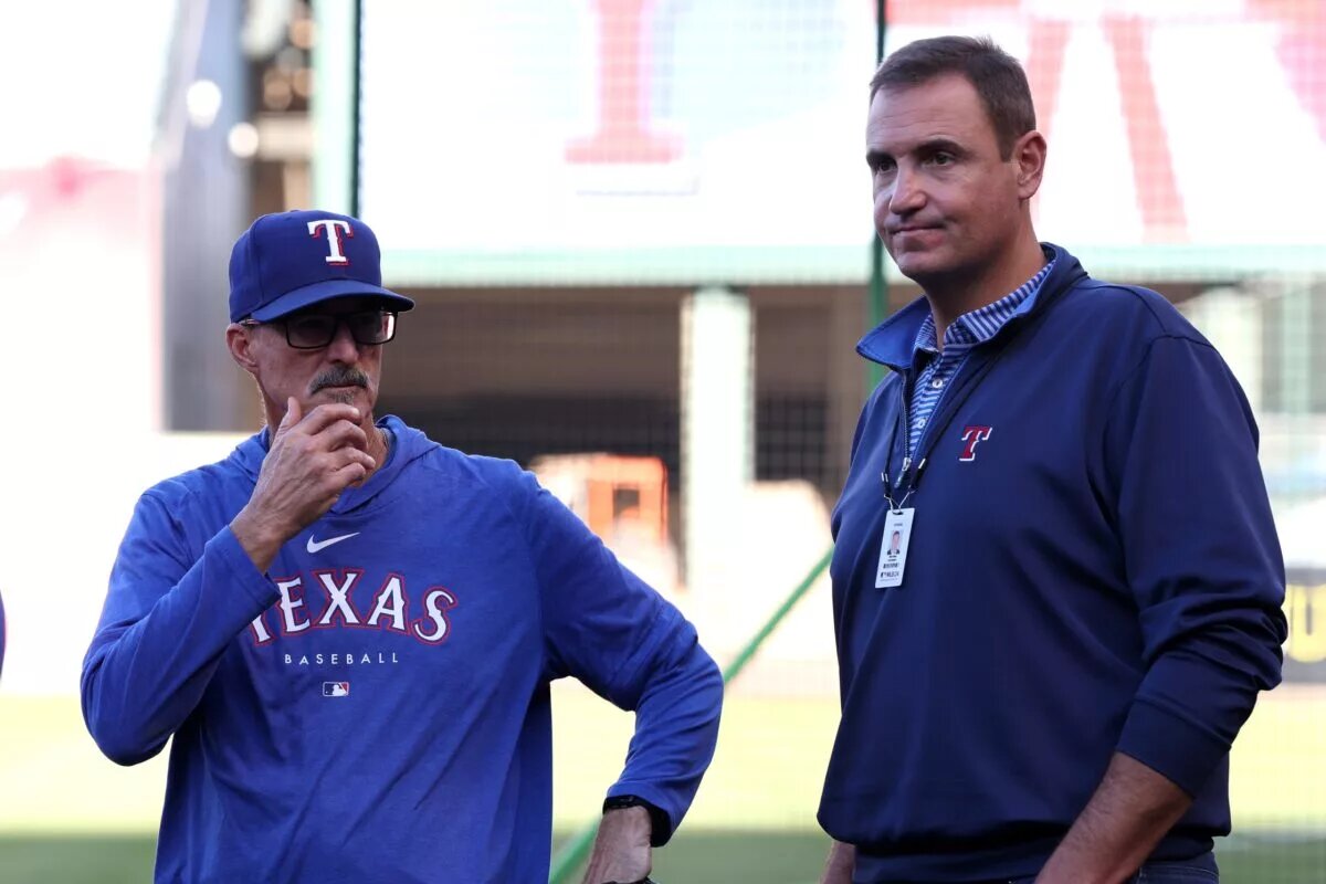 Rangers GM Chris Young (right), shown here with pitching coach Mike Maddux, still has several affordable free-agent relievers to choose from to bolster the team's bullpen this offseason.