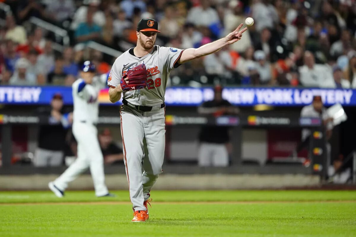 Baltimore Orioles pitcher Trevor Rogers (28) throws out New York Mets right fielder Starling Marte (not pictured) after fielding a bunt during the fourth inning at Citi Field in an August 2024 game.