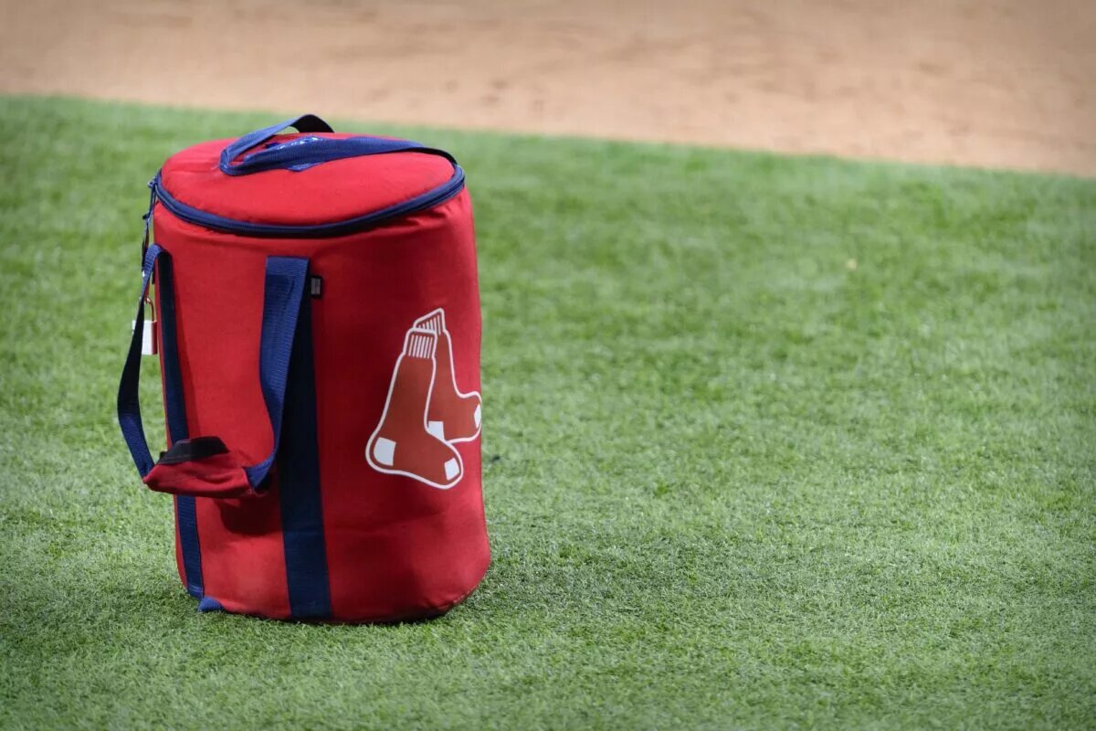 A view of the Boston Red Sox logo and a field bag during batting practice before the game between the Texas Rangers and the Boston Red Sox at Globe Life Field in April 2021.