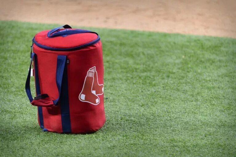 A view of the Boston Red Sox logo and a field bag during batting practice before the game between the Texas Rangers and the Boston Red Sox at Globe Life Field in April 2021.