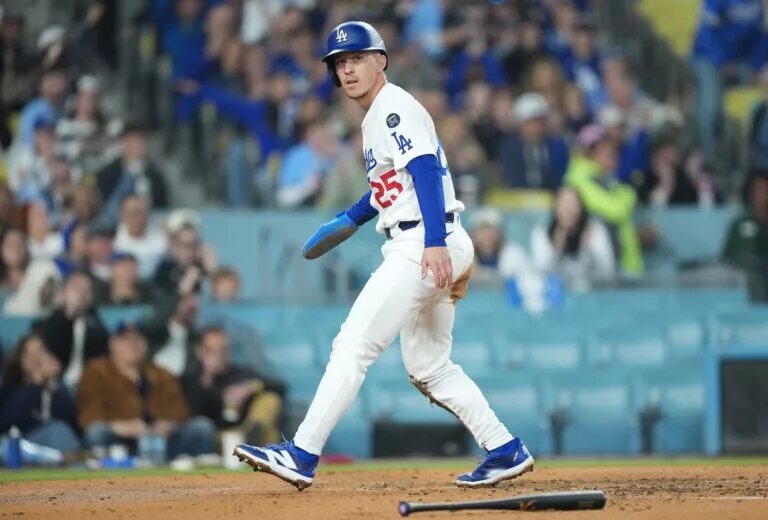 Dodgers second baseman Tommy Edman (25) celebrates after scoring at Dodger Stadium in April 2025.