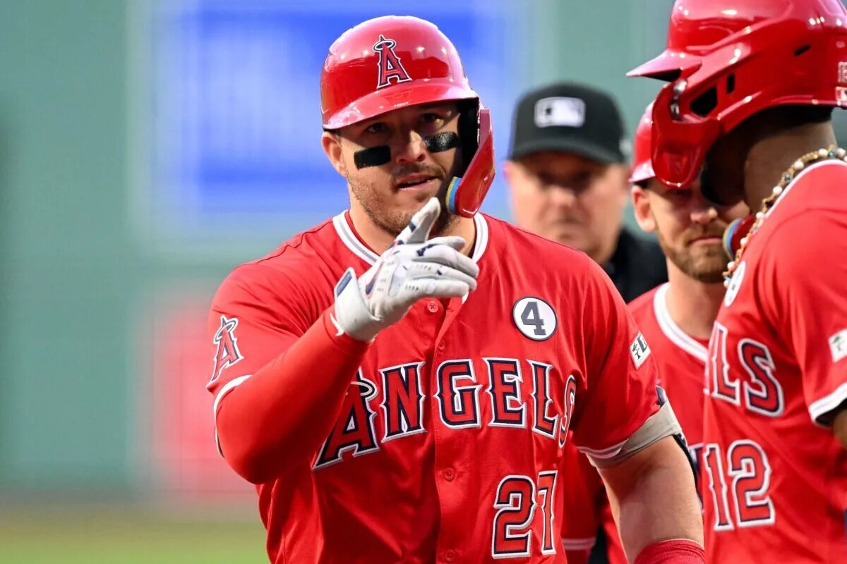 Angels outfielder Mike Trout (27) reacts after hitting a three-run home run against the Boston Red Sox during the first inning at Fenway Park in June 2025.