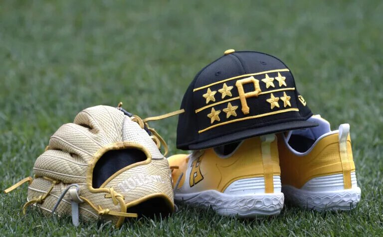 A cap shoes and glove belonging to Pittsburgh Pirates third base Ke'Bryan Hayes on the field before the game against the Los Angeles Dodgers at PNC Park in June 2024.