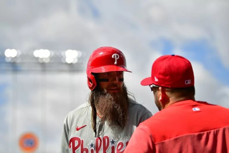 Does Kevin Long (right) have a future as the Phillies hitting coach after another early October exit?