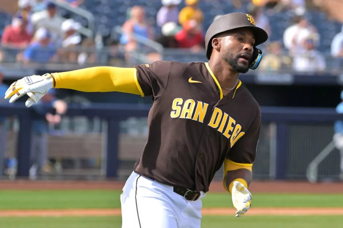 Miguel Andujar rounds the bases after homering for the Padres.
