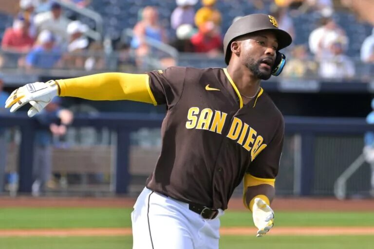 Miguel Andujar rounds the bases after homering for the Padres.