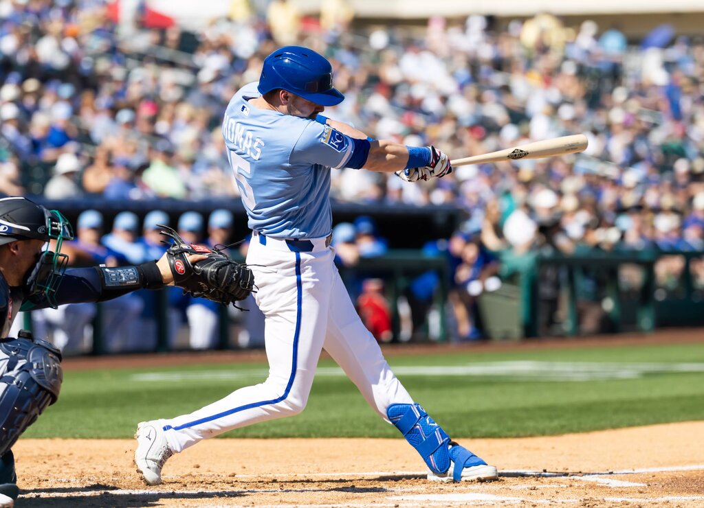 Kansas City Royals outfielder Lane Thomas swings through during a 2026 Spring Training at bat against the Seattle Mariners.