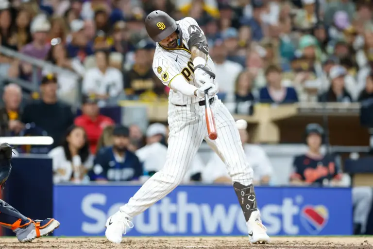 San Diego Padres designated hitter Nick Castellanos (21) hits a single during the sixth inning against the Detroit Tigers at Petco Park in March 2026.