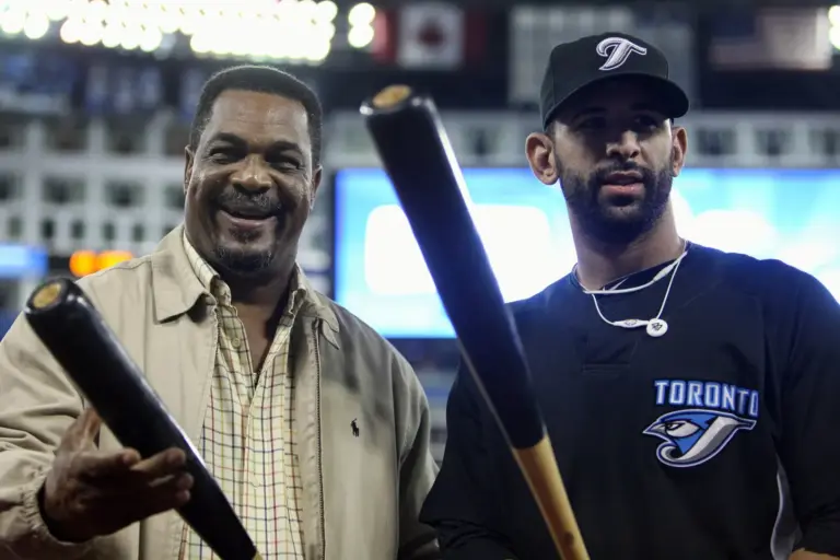 George Bell (left) became the first player in MLB history to hit three home runs in an Opening Day game.
