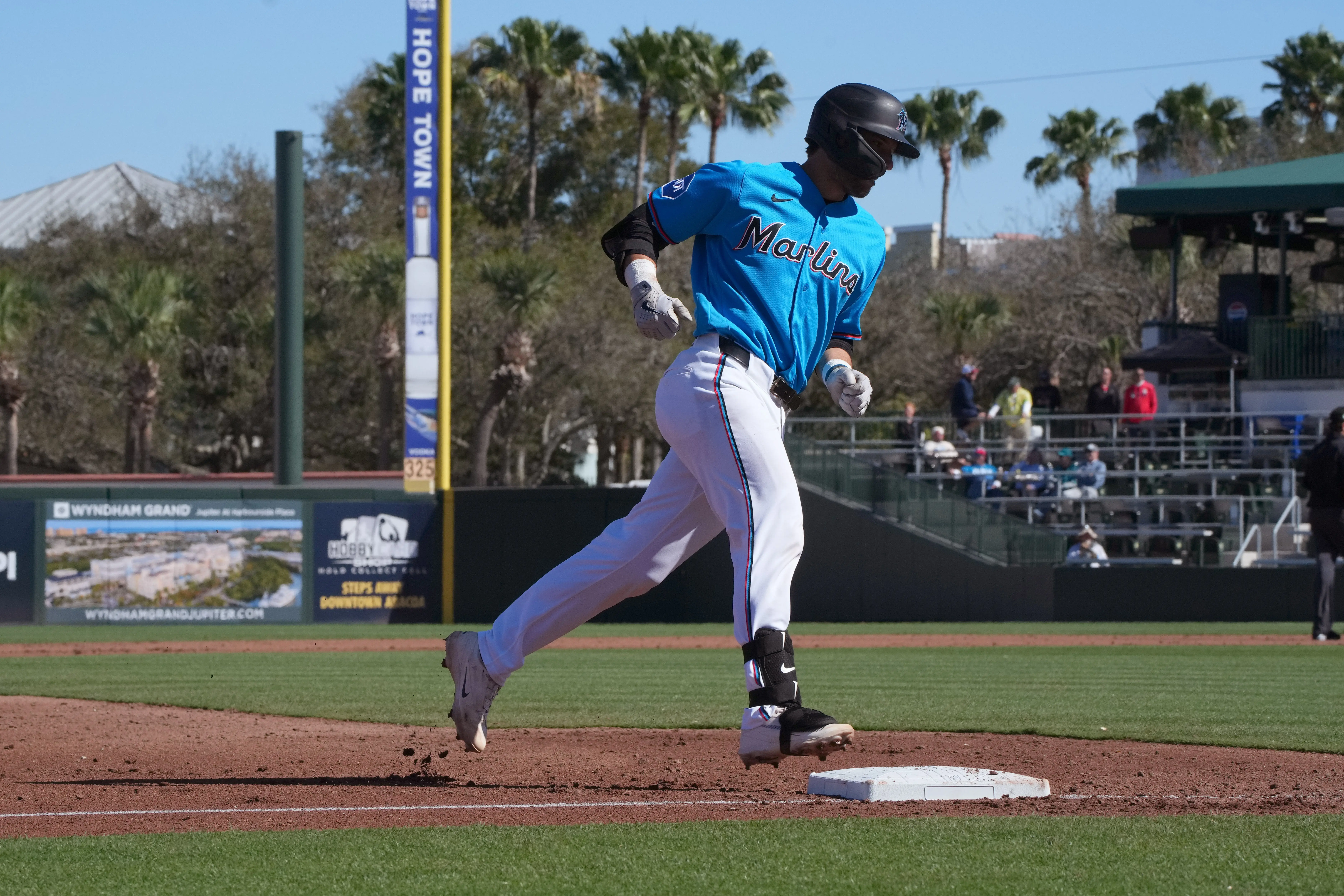 Miami Marlins catcher Joe Mack (80) rounds third base 