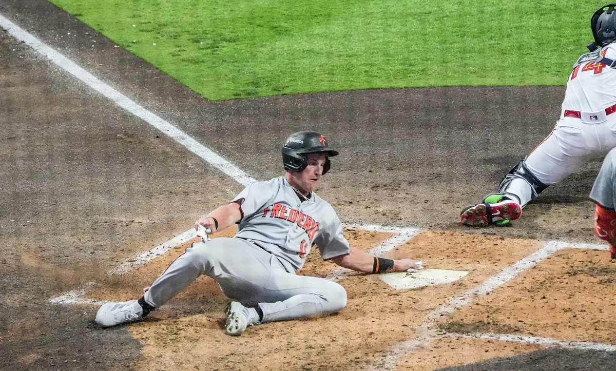 Frederick Keys catcher Ike Irish (11) scores during the season opening game at Fifth Third Park in Spartanburg, SC, Friday, April 3, 2026.