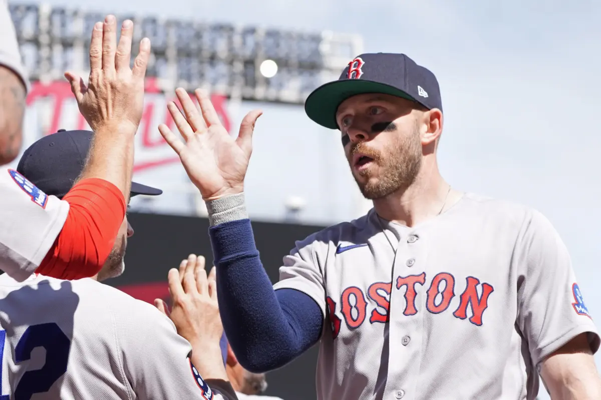 Boston Red Sox shortstop Trevor Story celebrates a win over the Minnesota Twins with teammates at Target Field in Minneapolis, Minnesota on April 15, 2026.