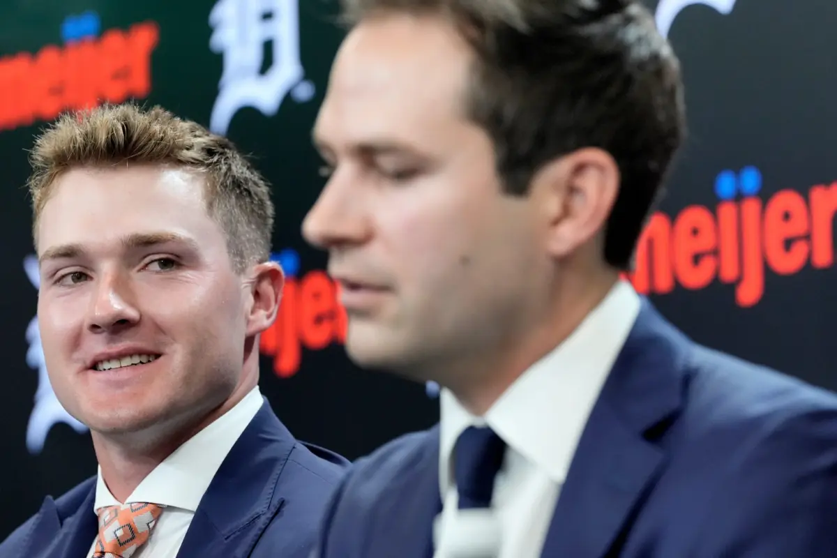 Image of Tigers PBO Scott Harris and young Kevin McGonigle at a Press Conference.
