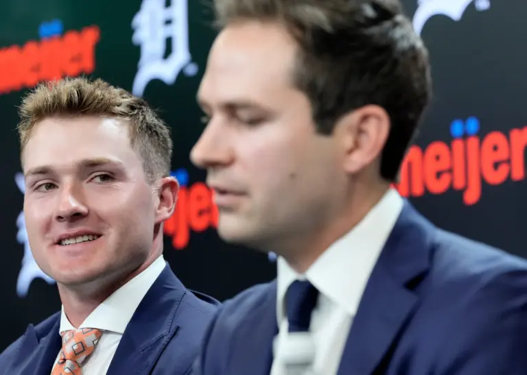 Image of Tigers PBO Scott Harris and young Kevin McGonigle at a Press Conference.
