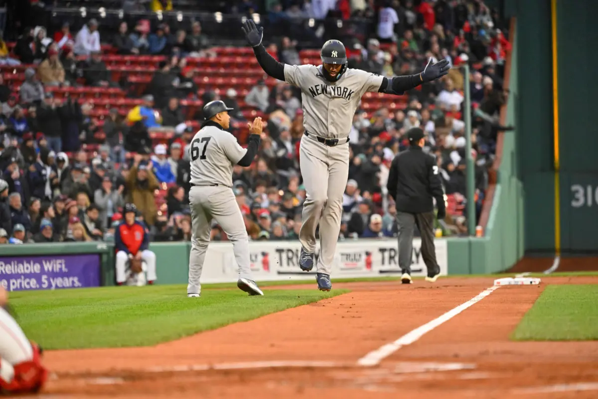 New York Yankees third baseman Amed Rosario celebrating after hitting a three-run home run against the Boston Red Sox on April 22, 2026 at Fenway Park in Boston Massachusetts.