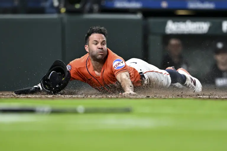 Houston Astros left fielder Jose Altuve sliding into home plate during the second inning against the New York Yankees at Daikin Park in Houston, Texas on April 24, 2026.