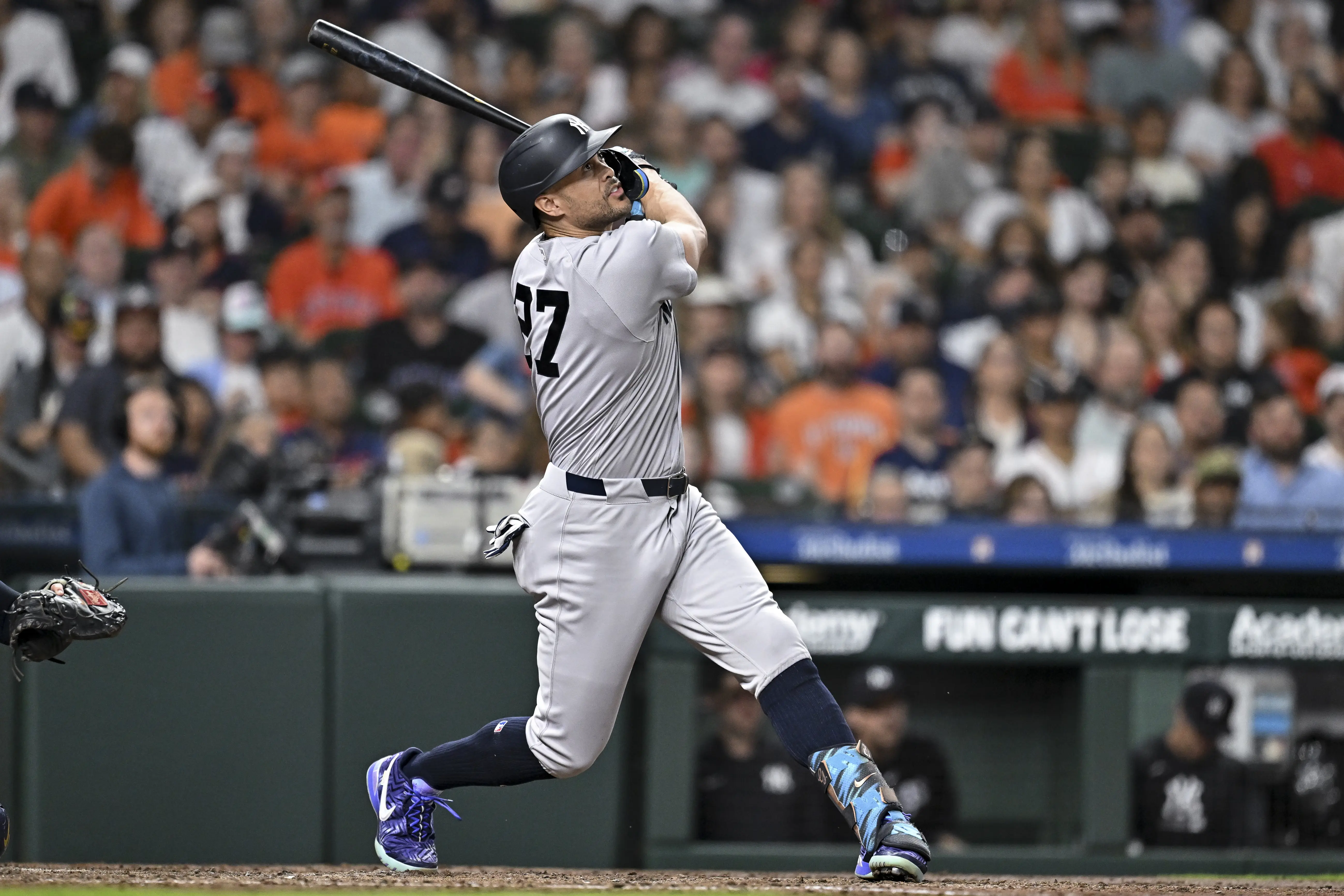 Giancarlo Stanton (27) hits the ball in the third inning against the Houston Astros at Daikin Park.