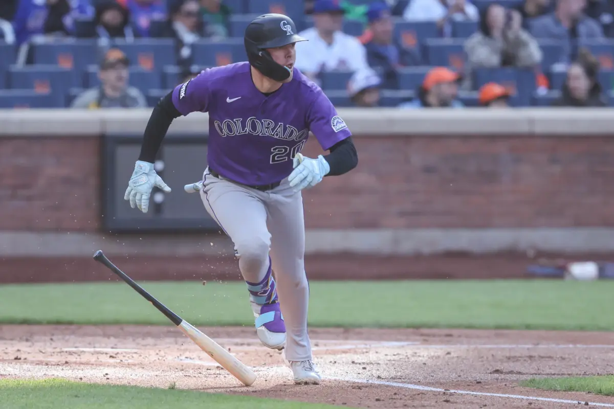 Colorado Rockies Designated Hitter Troy Johnston running to first base following a hit against the New York Mets on April 26, 2026 in Queens, New York.