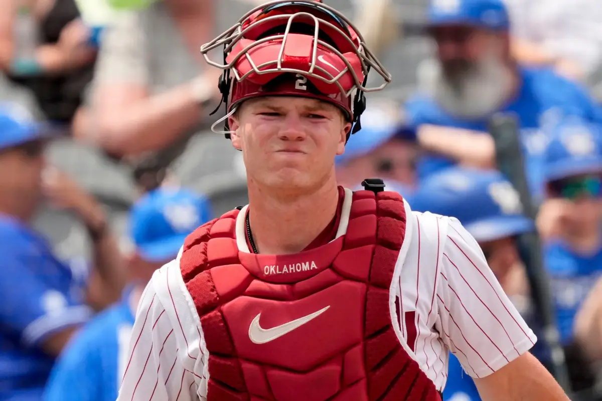 Oklahoma Sooners catcher Easton Carmichael grimacing after taking a foul ball off his ankle during Oklahoma's game against the Kentucky Wildcats in the first round of the SEC baseball tournament at the Hoover Met in Hoover, Alabama.