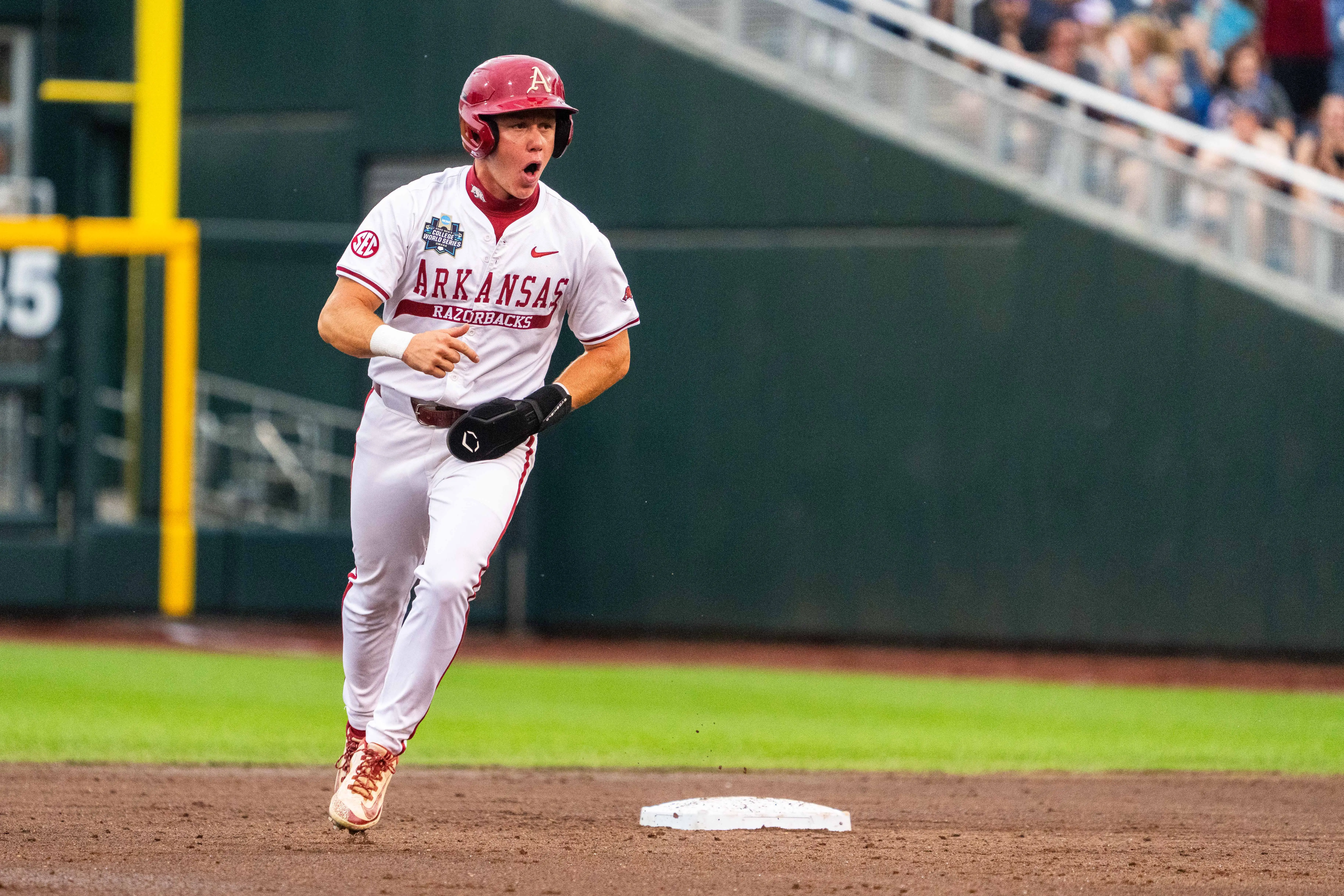 rkansas Razorbacks left fielder Charles Davalan (24) celebrates after a two-run home run