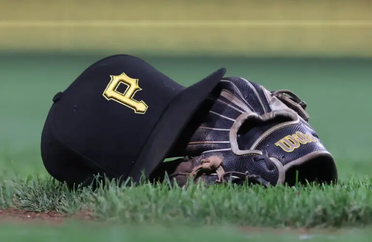 A Pittsburgh Pirates hat and glove belonging to Pirates' third baseman Jared Triolo.