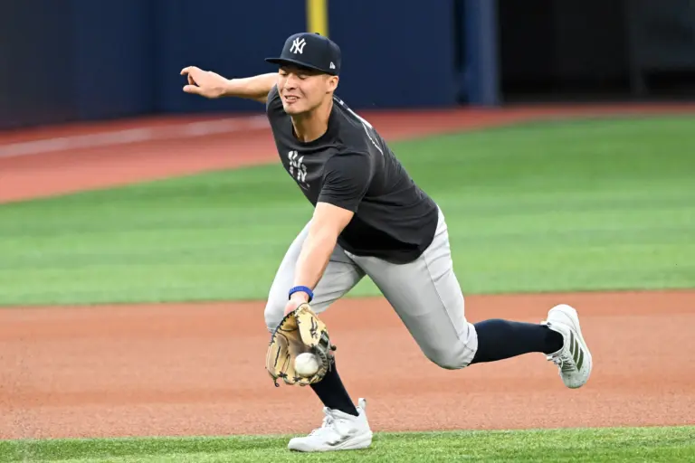 New York Yankees shortstop Anthony Volpe (11) fields the ball during workouts at Rogers Centre.