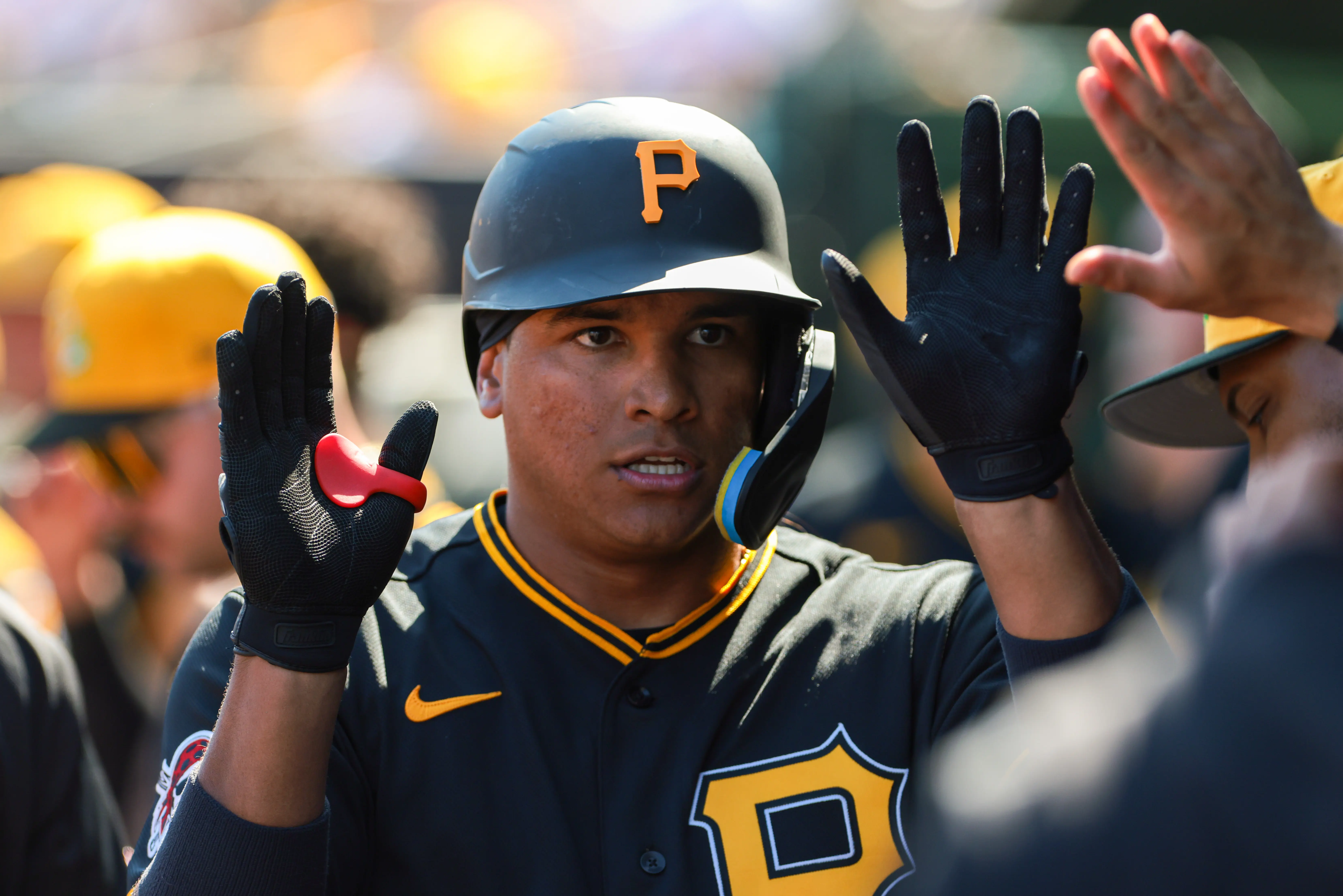 Pirates left fielder Jhostynxon Garcia (34) celebrates after hitting a home run against the St. Louis Cardinals during the fourth inning at Roger Dean Chevrolet Stadium. 
