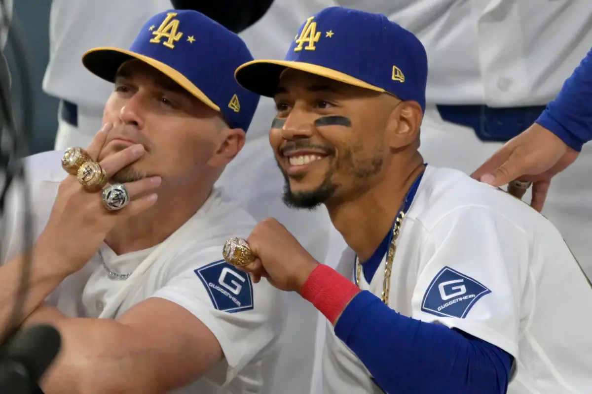 Dodgers third baseman Enrique Hernandez (8) and shortstop Mookie Betts (50) with their World Series rings during a ceremony prior to the game against the Arizona Diamondbacks