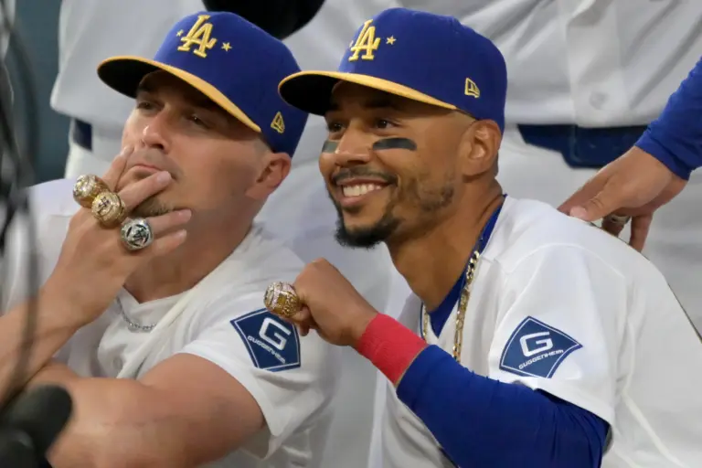 Dodgers third baseman Enrique Hernandez (8) and shortstop Mookie Betts (50) with their World Series rings during a ceremony prior to the game against the Arizona Diamondbacks
