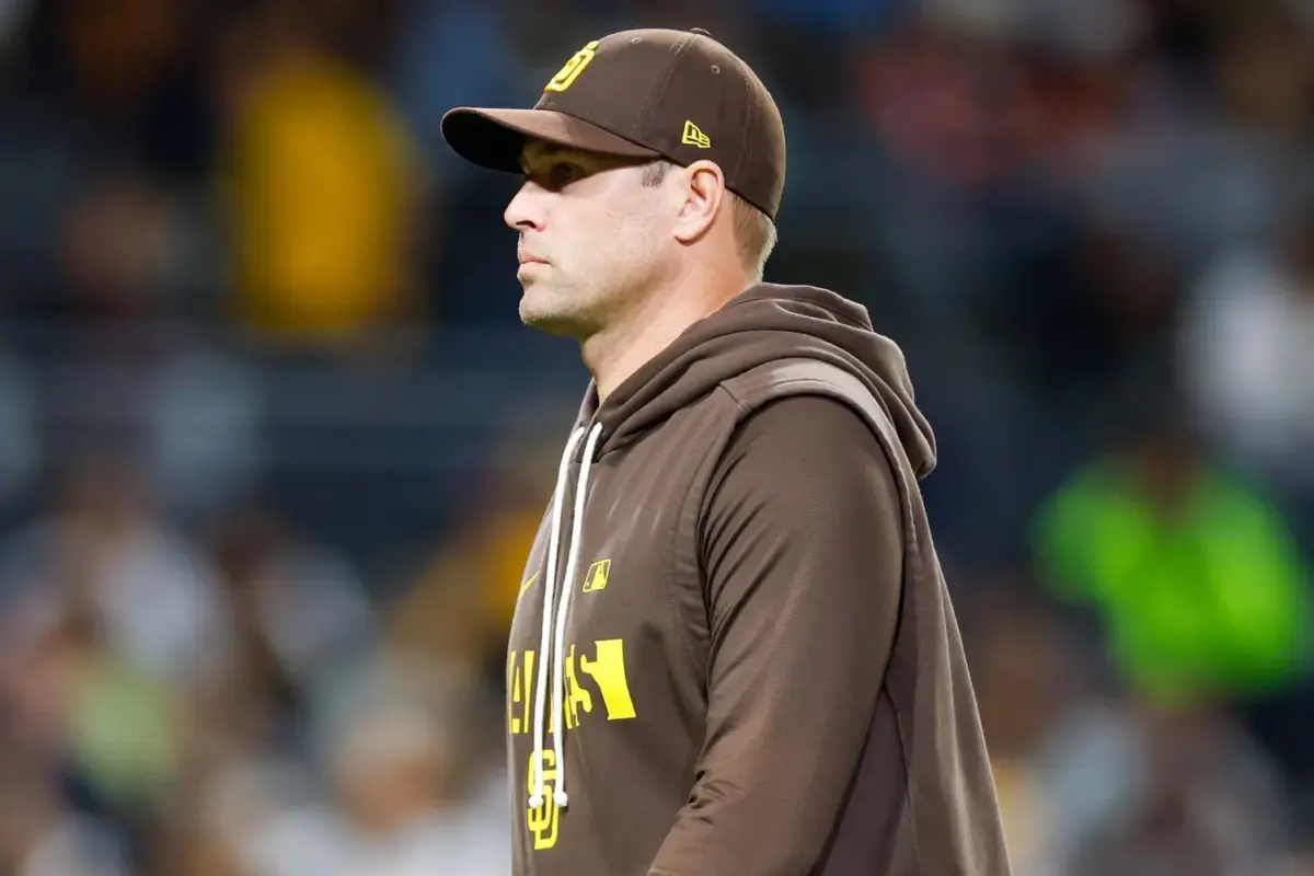 Manager Craig Stammen walks to the Padres dugout
