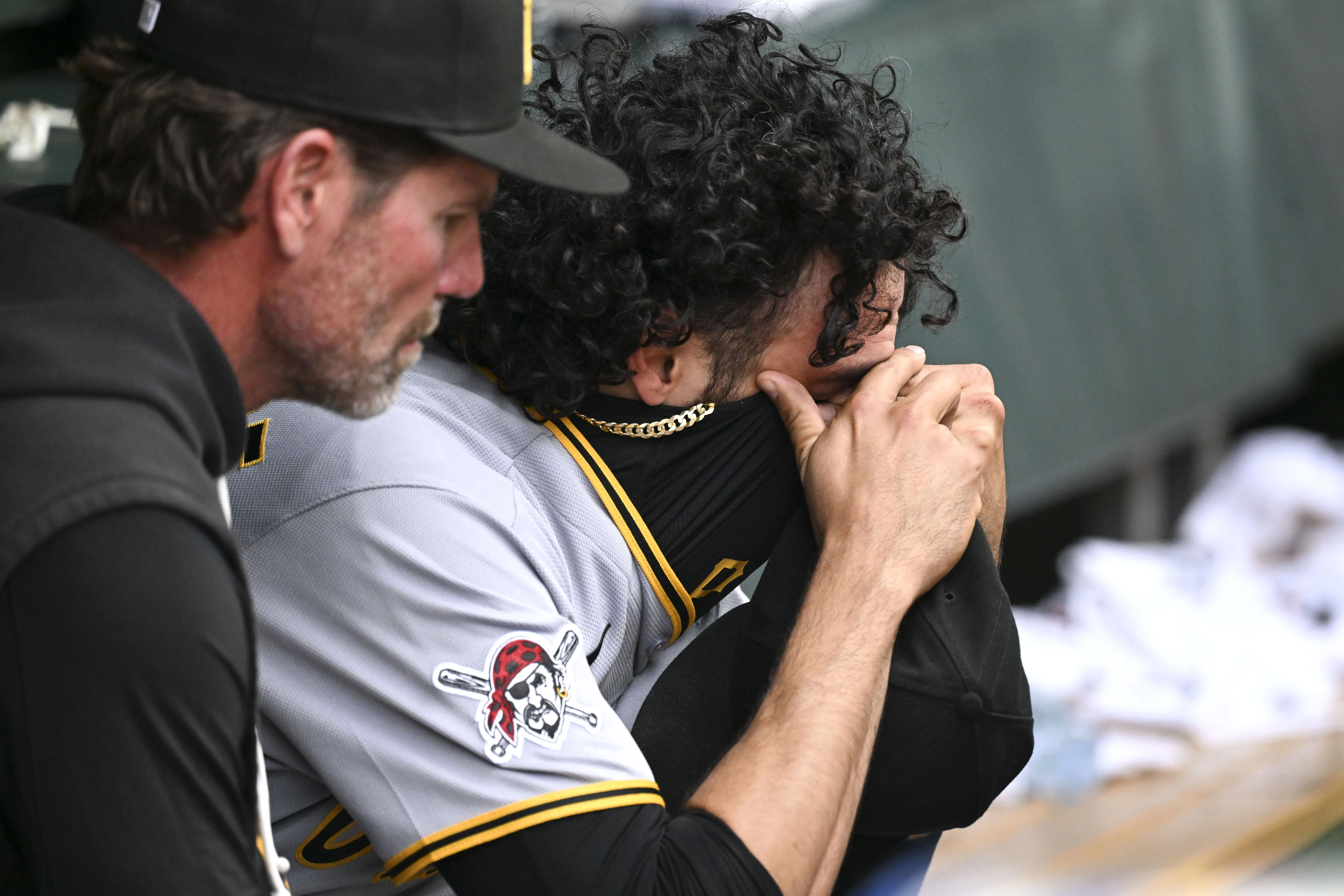 Pittsburgh Pirates reliever Justin Lawrence being consoled in the dugout following a tough outing against the Chicago Cubs at Wrigley Field in Chicago, Illinois on April 12, 2026.