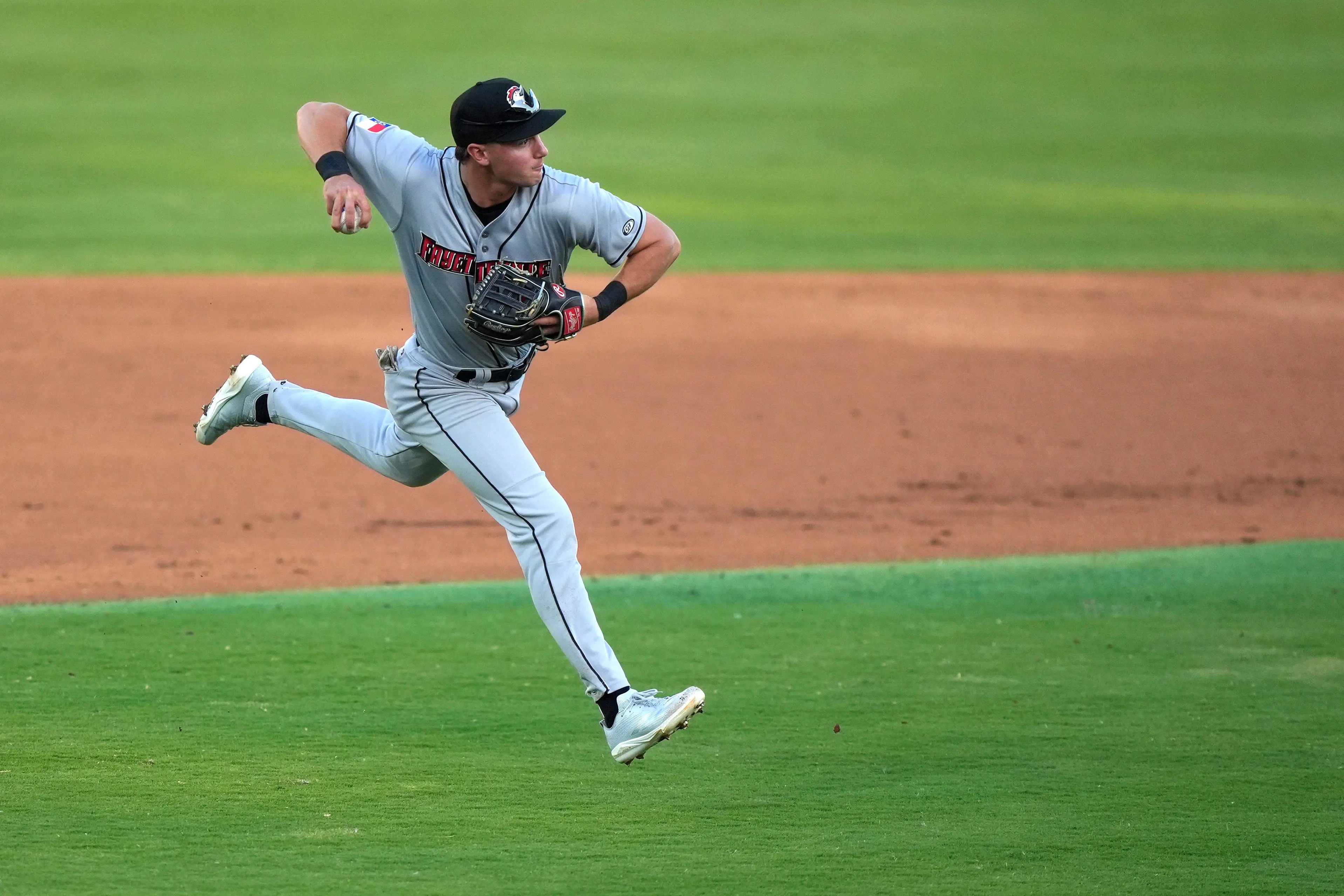Fayetteville infielder Xavier Neyens (9) throws the ball during opening day of the Augusta GreenJackets 