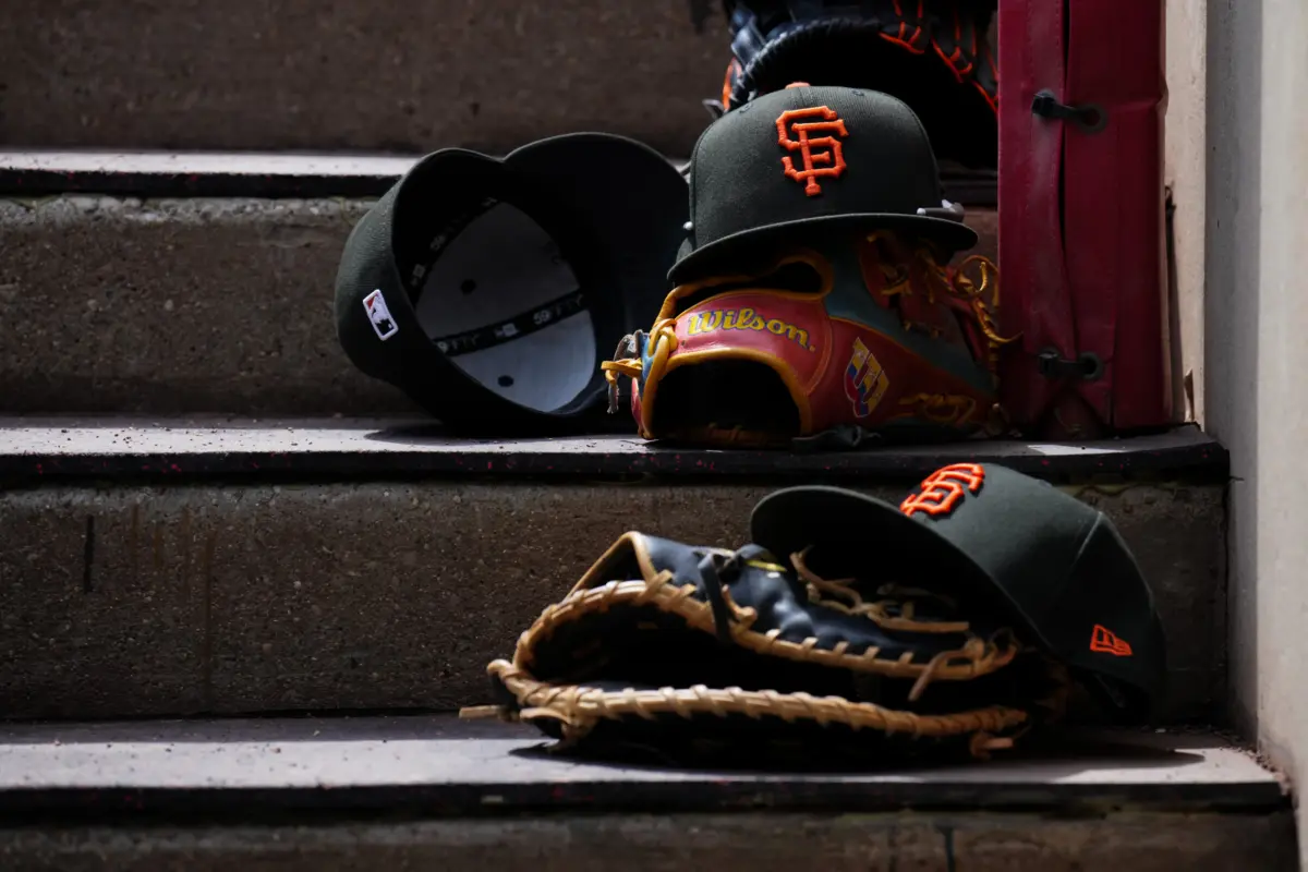 San Francisco Giants hats on the dugout steps during a game between the Cincinnati Reds and San Francisco Giants on April 16, 2026, in Cincinnati, Ohio.
