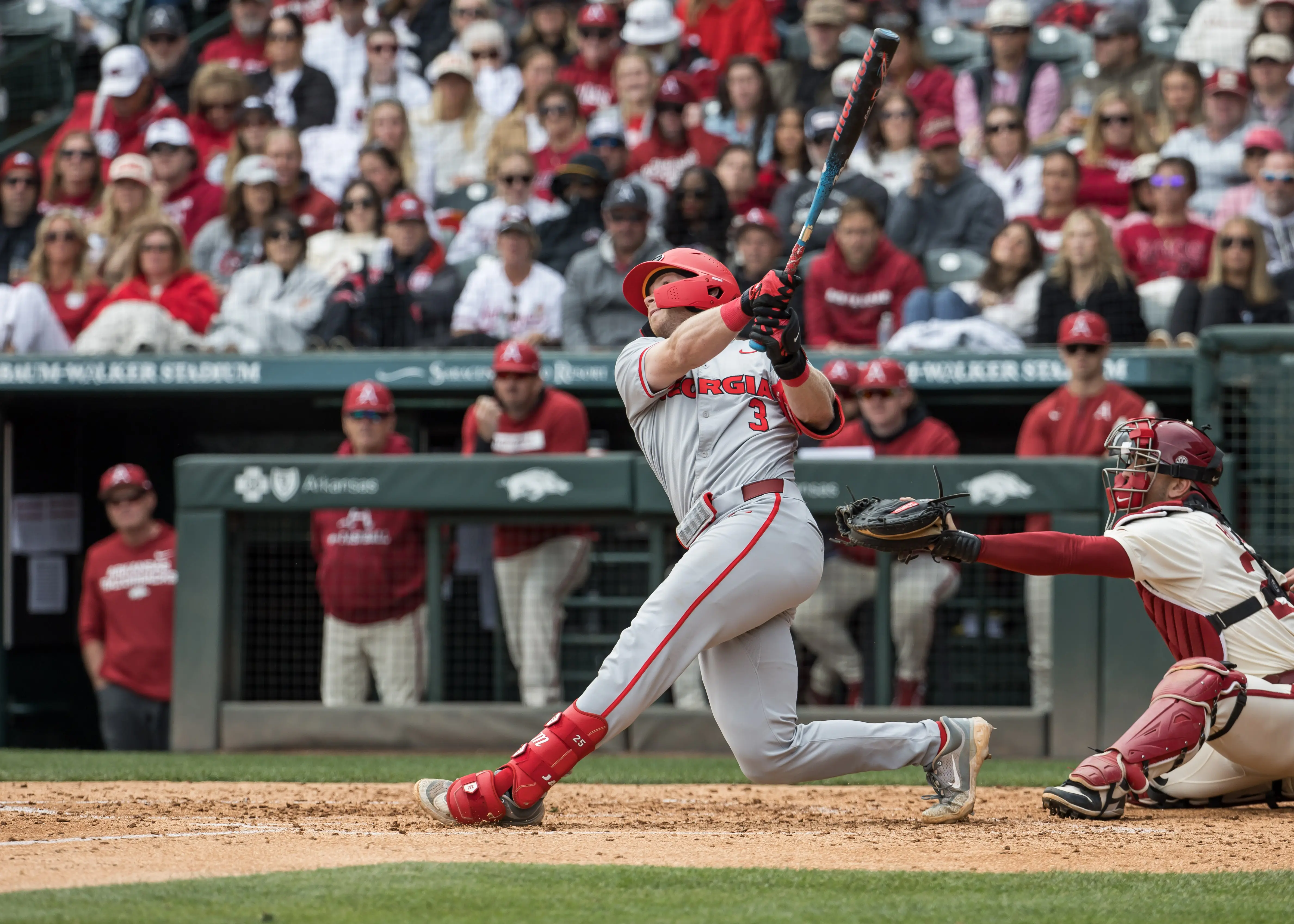 Georgia Bulldogs catcher Daniel Jackson hits a single during the fourth inning against the Arkansas Razorbacks at Baum-Walker stadium in Fayetteville, Arkansas on April 18, 2026.