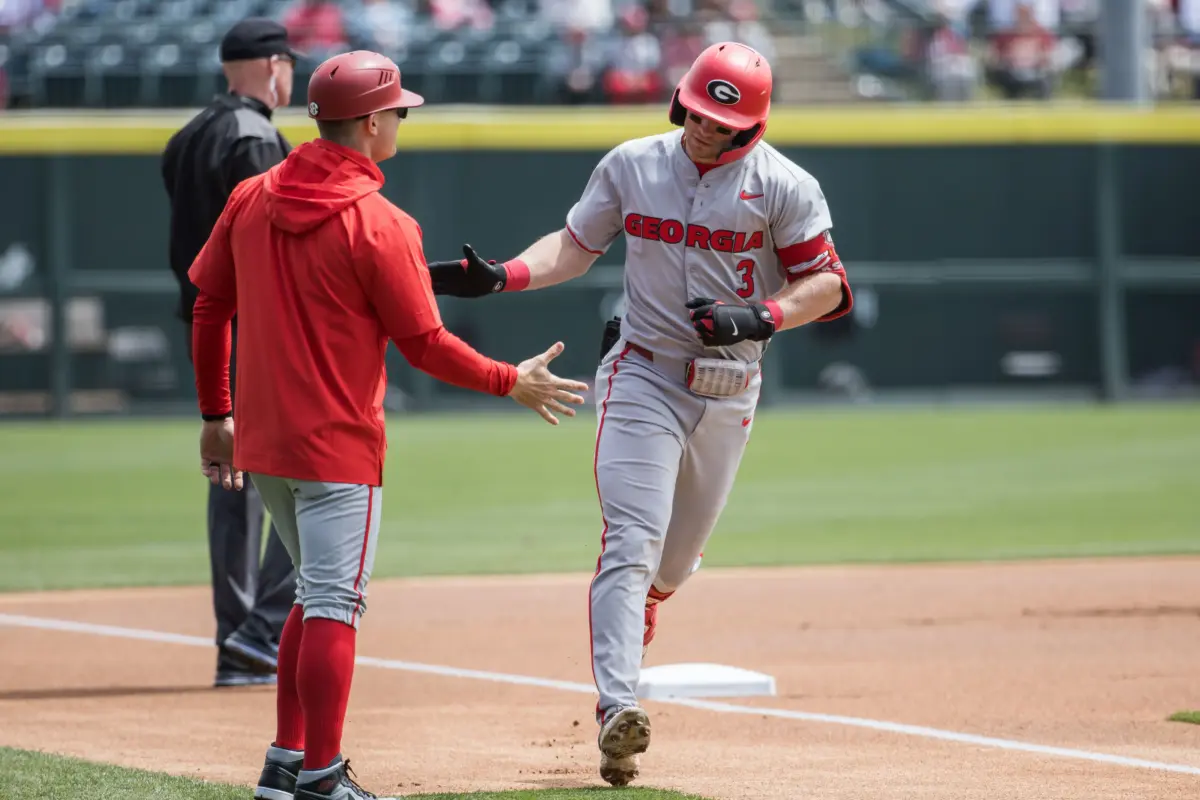 Georgia Bulldogs catcher Daniel Jackson trotting around the bases after hitting a solo home run against the Arkansas Razorbacks during the first inning at Baum-Walker stadium in Fayetteville, Arkansas on April 18, 2026.