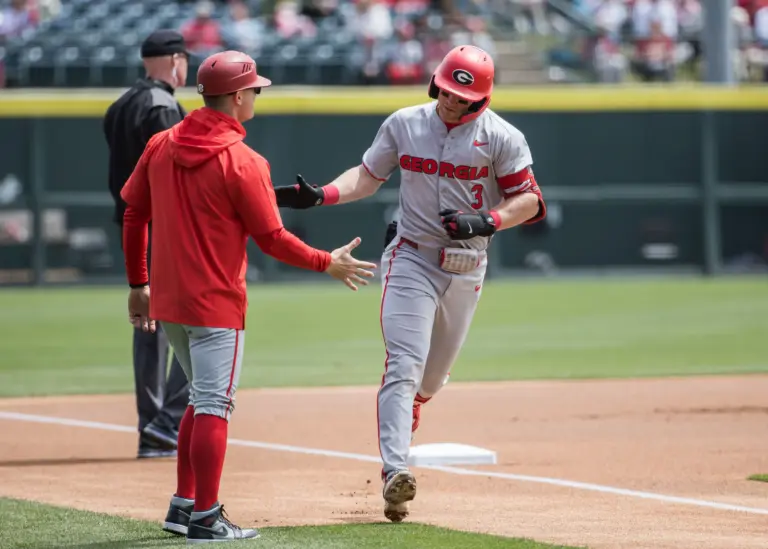 Georgia Bulldogs catcher Daniel Jackson trotting around the bases after hitting a solo home run against the Arkansas Razorbacks during the first inning at Baum-Walker stadium in Fayetteville, Arkansas on April 18, 2026.
