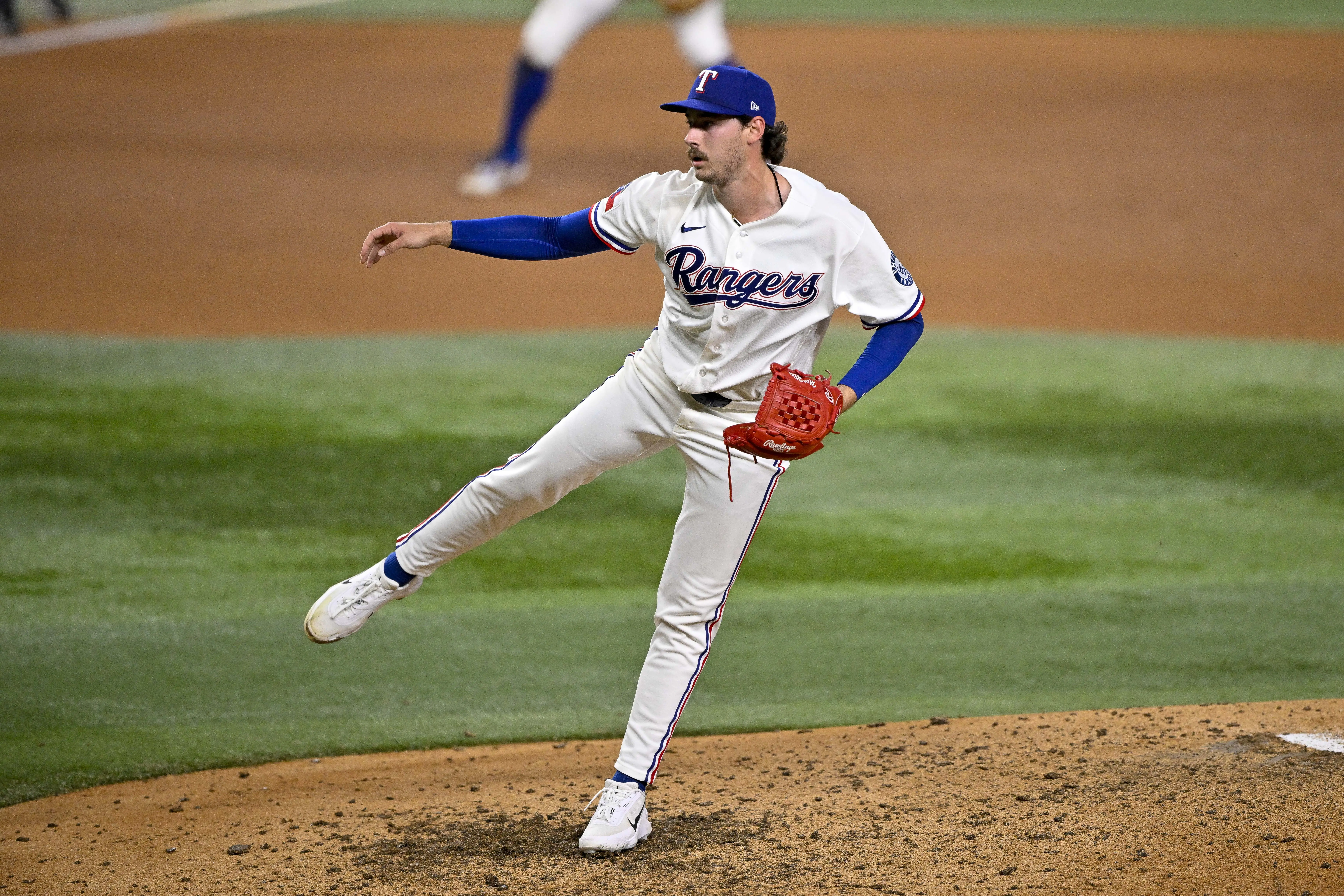 Texas Rangers relief pitcher Cole Winn (60) throws the ball during the game between the Rangers and the Pirates at Globe Life Field. 