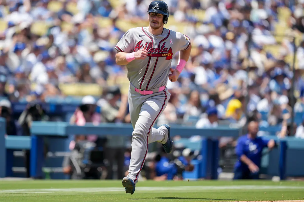 Atlanta Braves catcher Sean Murphy scoring a run against the Los Angeles Dodgers on May 10, 2026 at Dodger Stadium in Los Angeles, California.