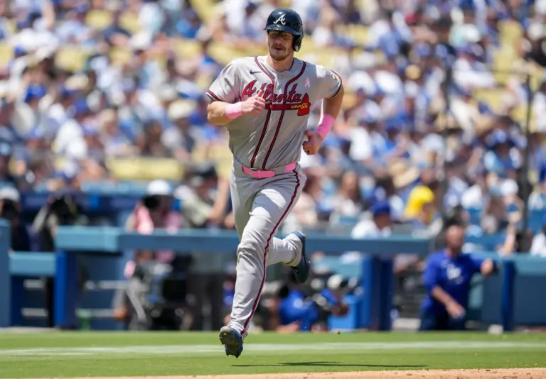 Atlanta Braves catcher Sean Murphy scoring a run against the Los Angeles Dodgers on May 10, 2026 at Dodger Stadium in Los Angeles, California.