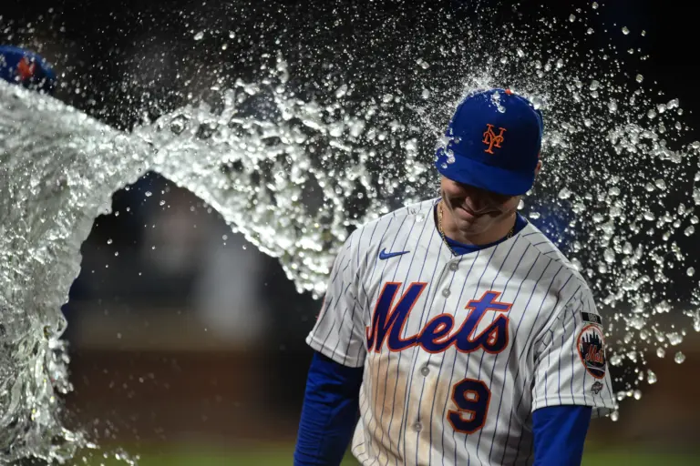 New York Mets outfielder A.J. Ewing (9) is doused with ice water after the game against the Detroit Tigers at Citi Field.