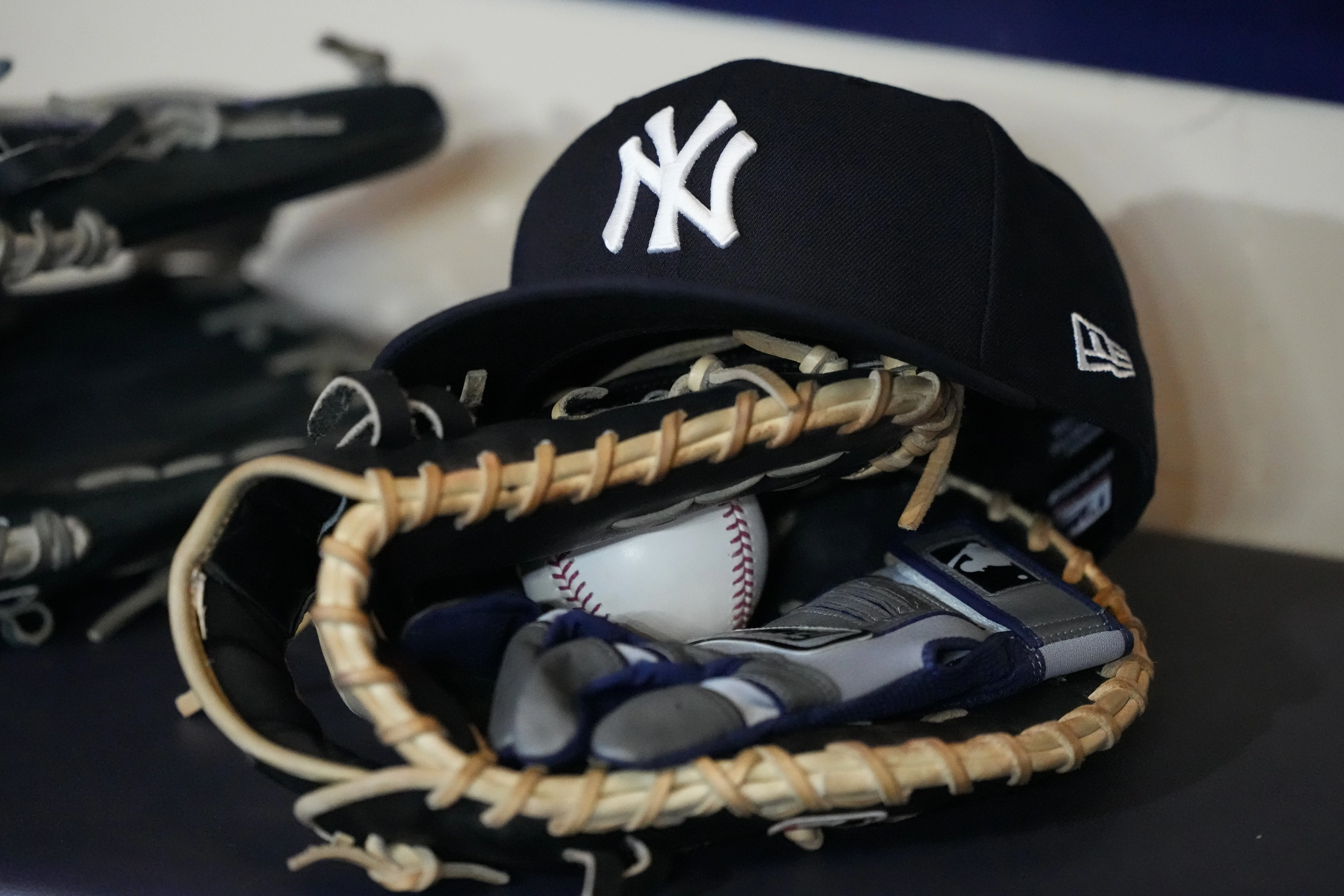 A New York Yankees hat and glove in the dugout at American Family Field in Milwaukee, Wisconsin, prior to a game between the Yankees and Milwaukee Brewers on May 8, 2026.