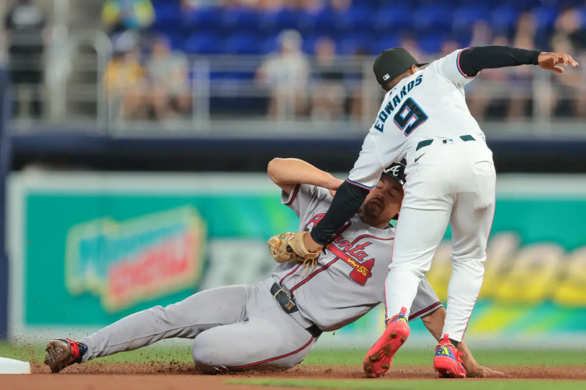 Miami Marlins second baseman Xavier Edwards tags out Atlanta Braves catcher Drake Baldwin during the first inning at loanDepot Park in Miami, Florida, on May 18, 2026.